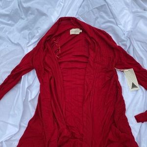 Red cardigan sweater.